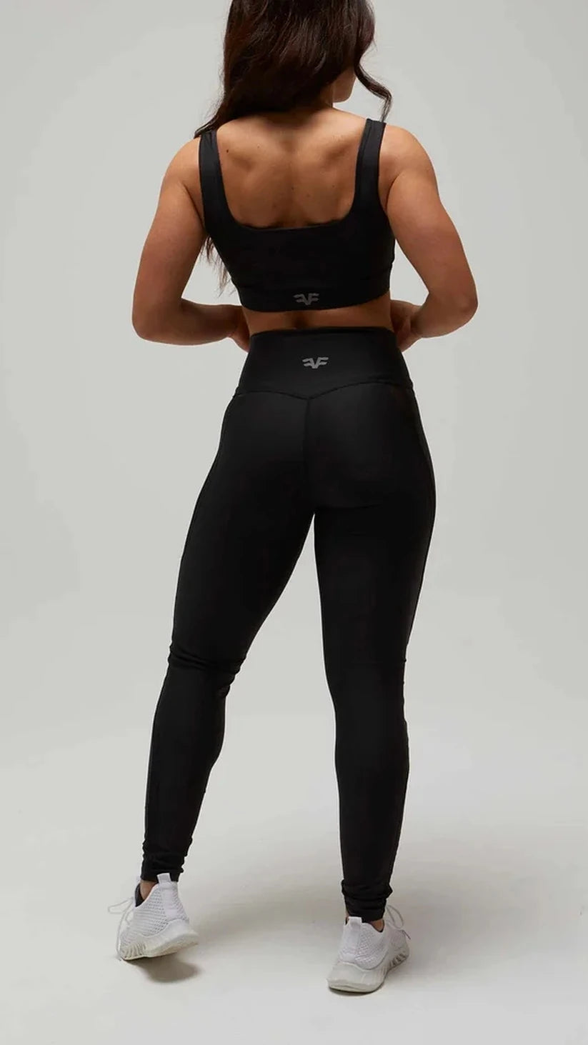 Completo sportivo nero Flexivel, leggings a vita alta e top con logo, vista posteriore