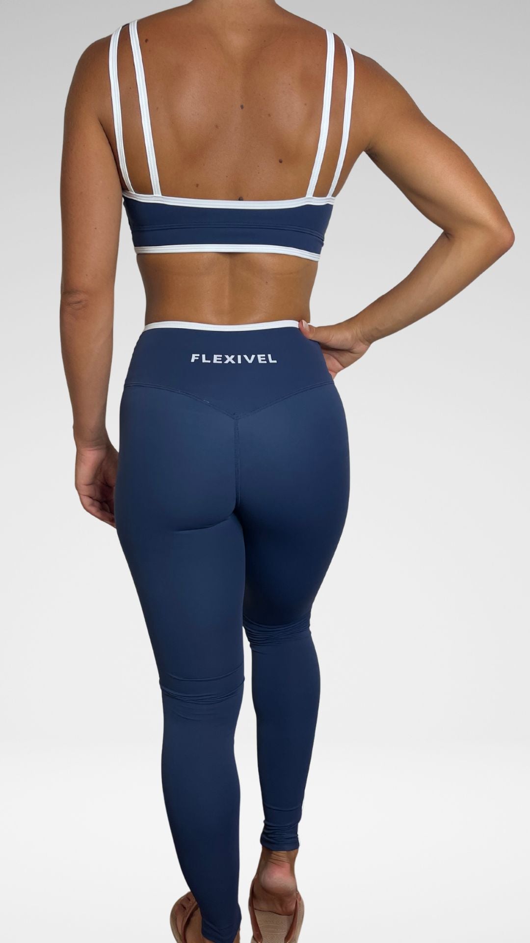 Leggings sportivi Flexivel blu vista posteriore con logo Flexivel in vita