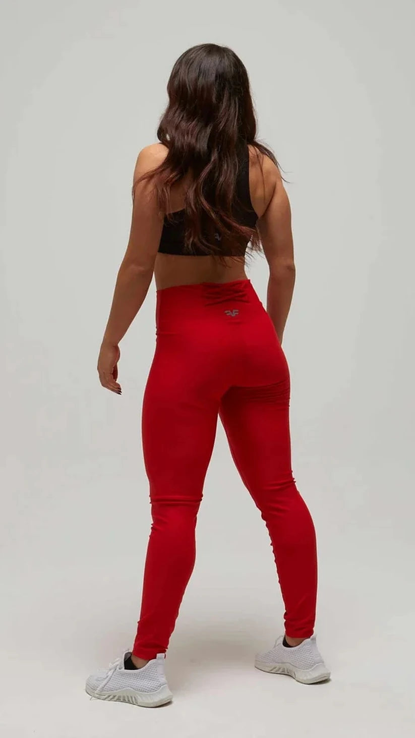 Leggings rossi a vita alta Flexivel con top sportivo nero, vista posteriore a figura intera